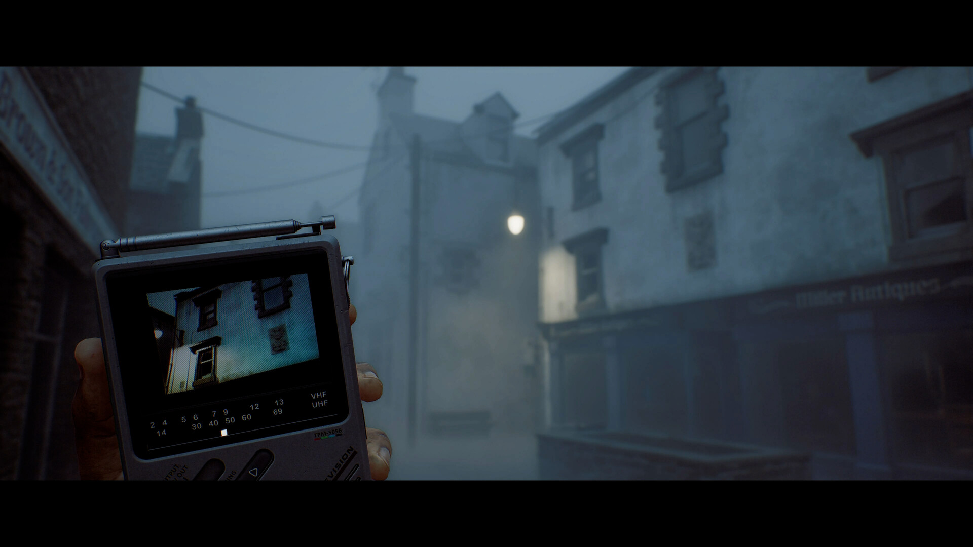 Simon holding the CRTV portable television while scanning for a signal